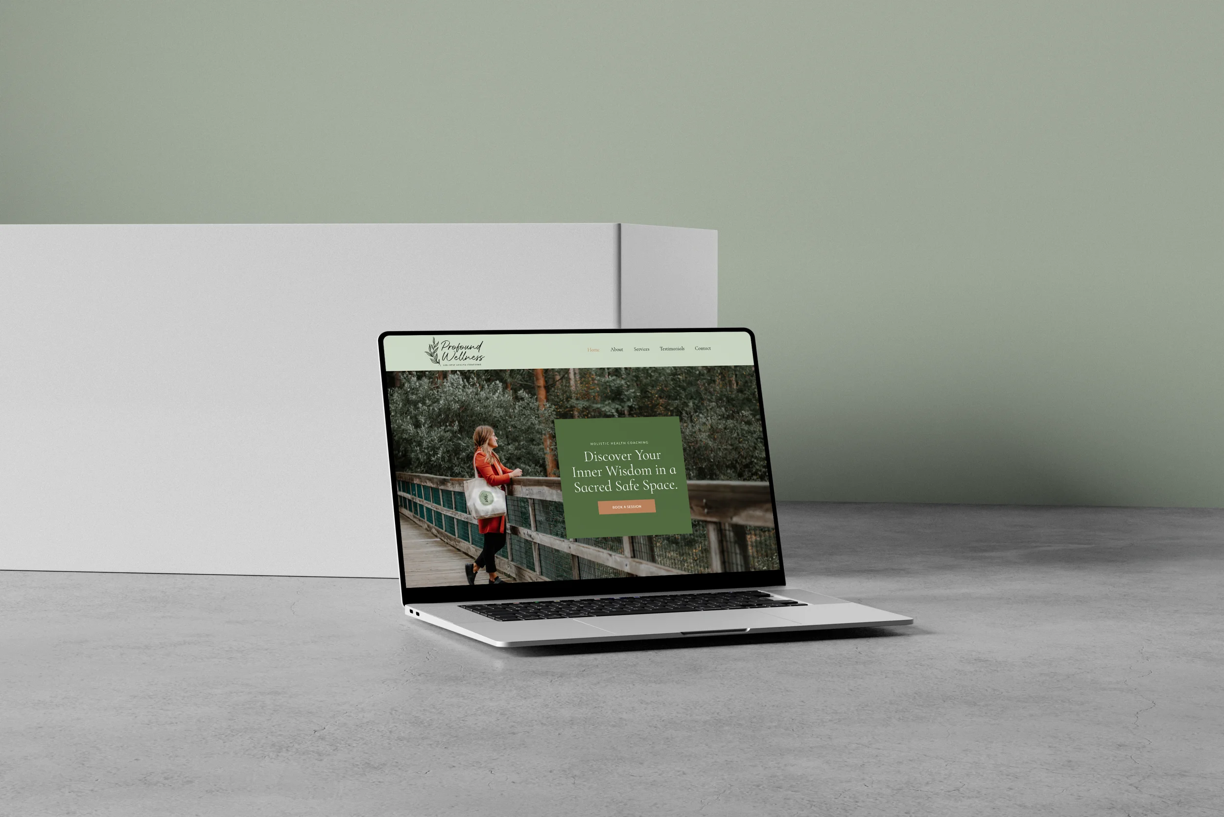 Modern Coaching Website Design Profound Wellness coaching website on a laptop in a bright, minimal workspace, website design by Dream Wild Studio