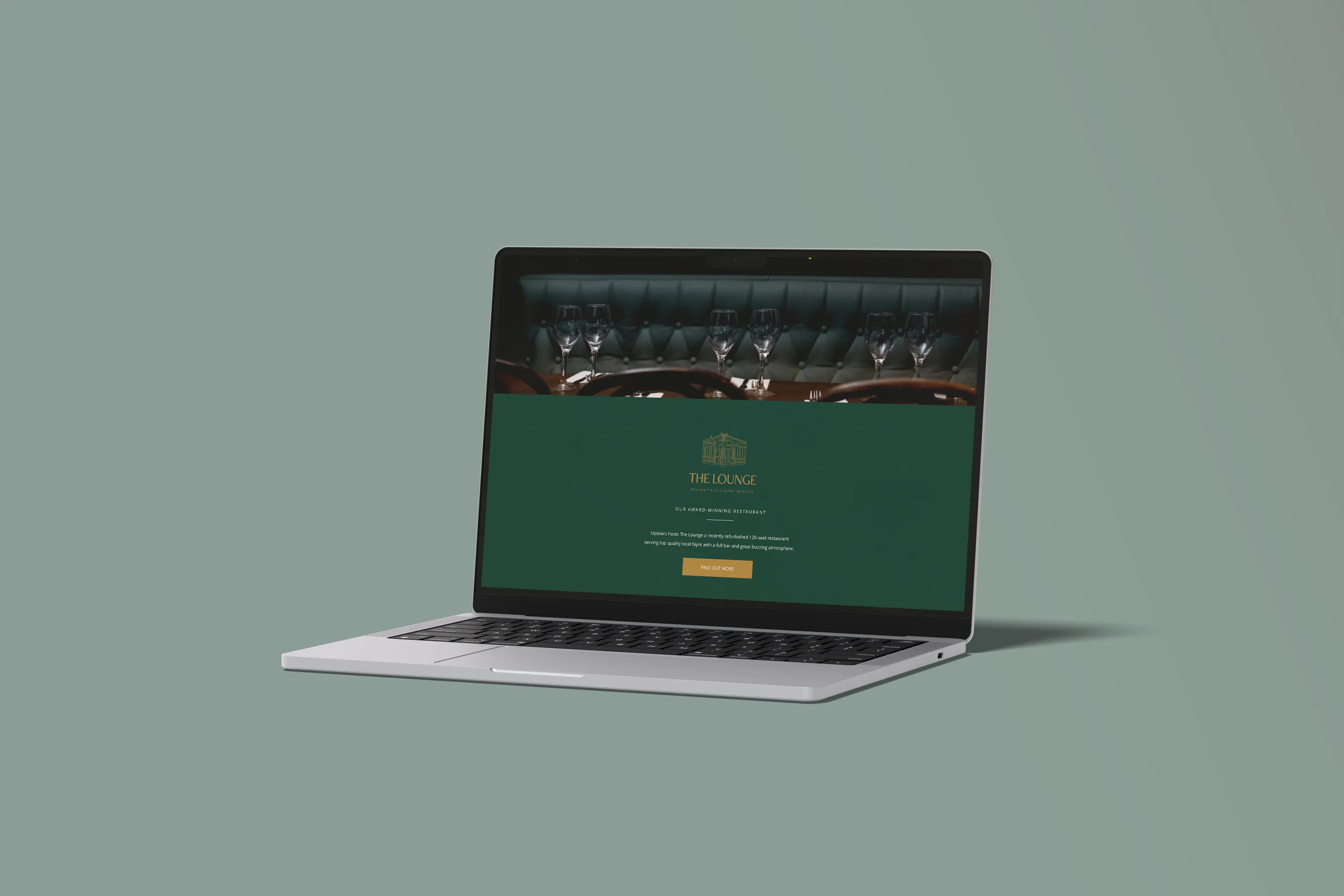 Open laptop displaying an elegant dark gastro pub website design, designed by Dream Wild Studio