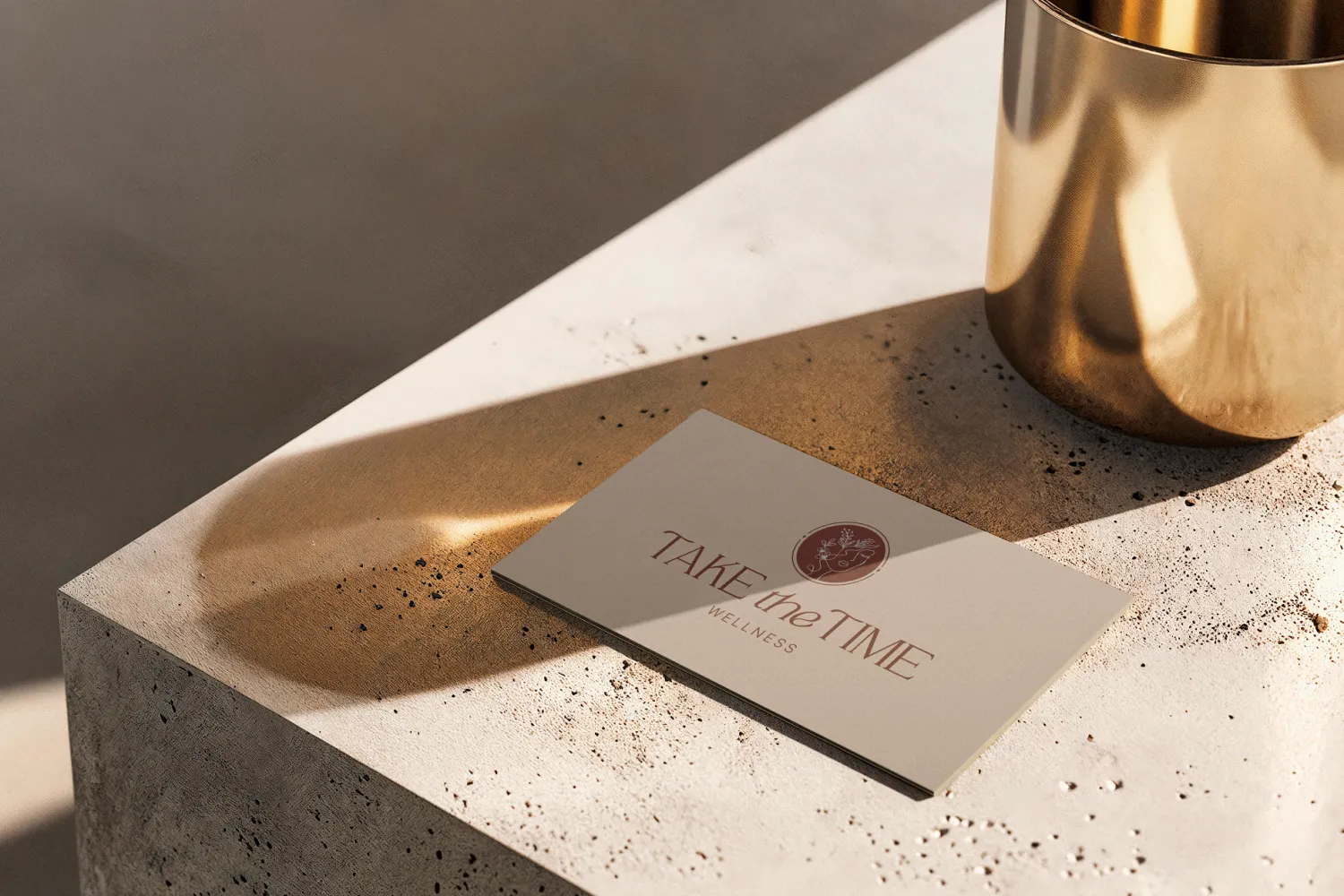 Take the Time Wellness business card beside a gold vessel for a holistic coaching company, branding by Dream Wild Studio