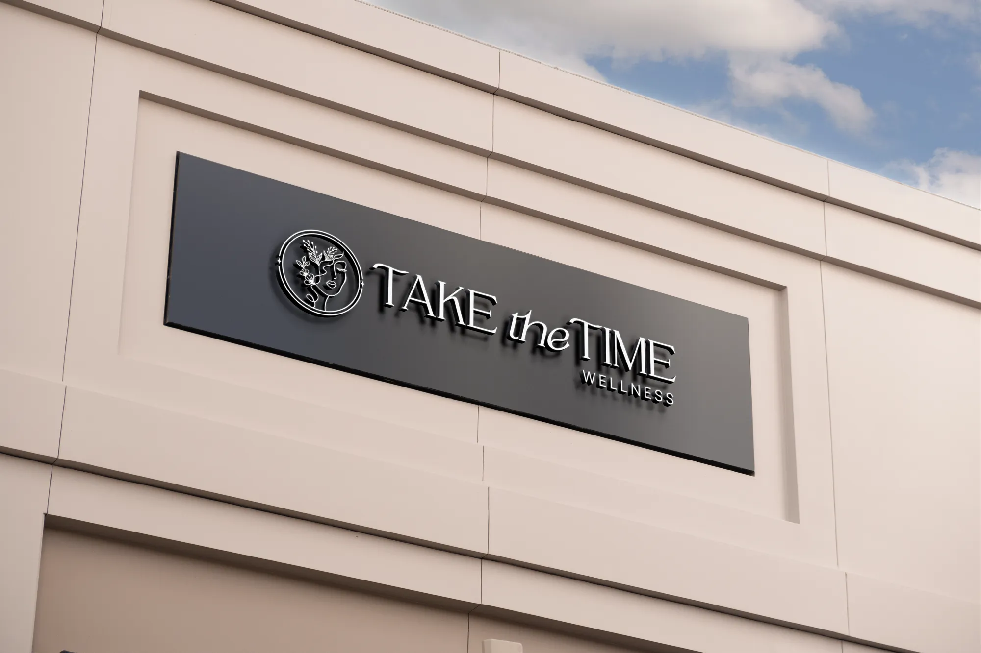 Take the Time Wellness logo on an exterior building sign for a holistic coaching company, branding by Dream Wild Studio
