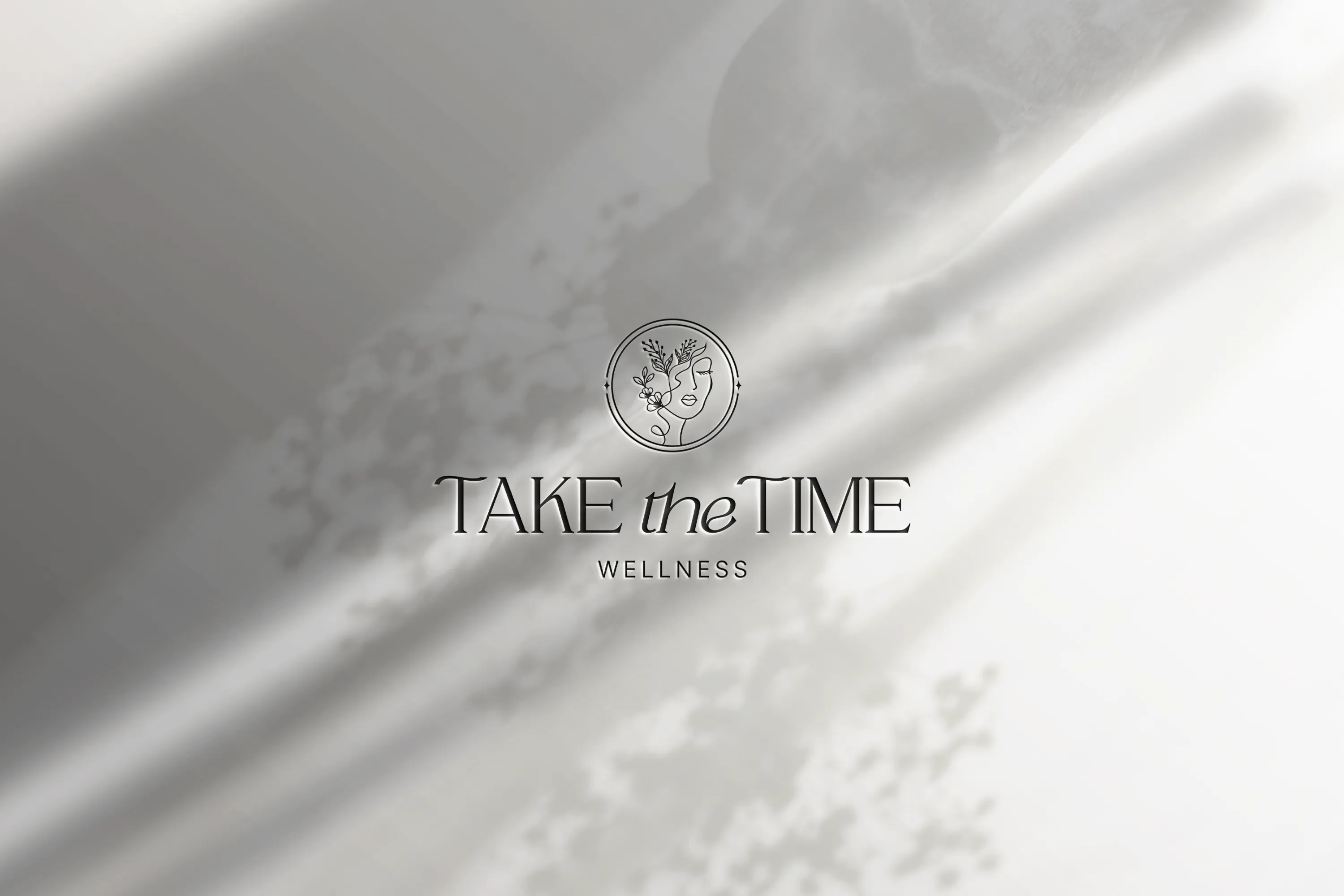 Take the Time Wellness logo for a holistic coaching company on a soft textured background, branding by Dream Wild Studio