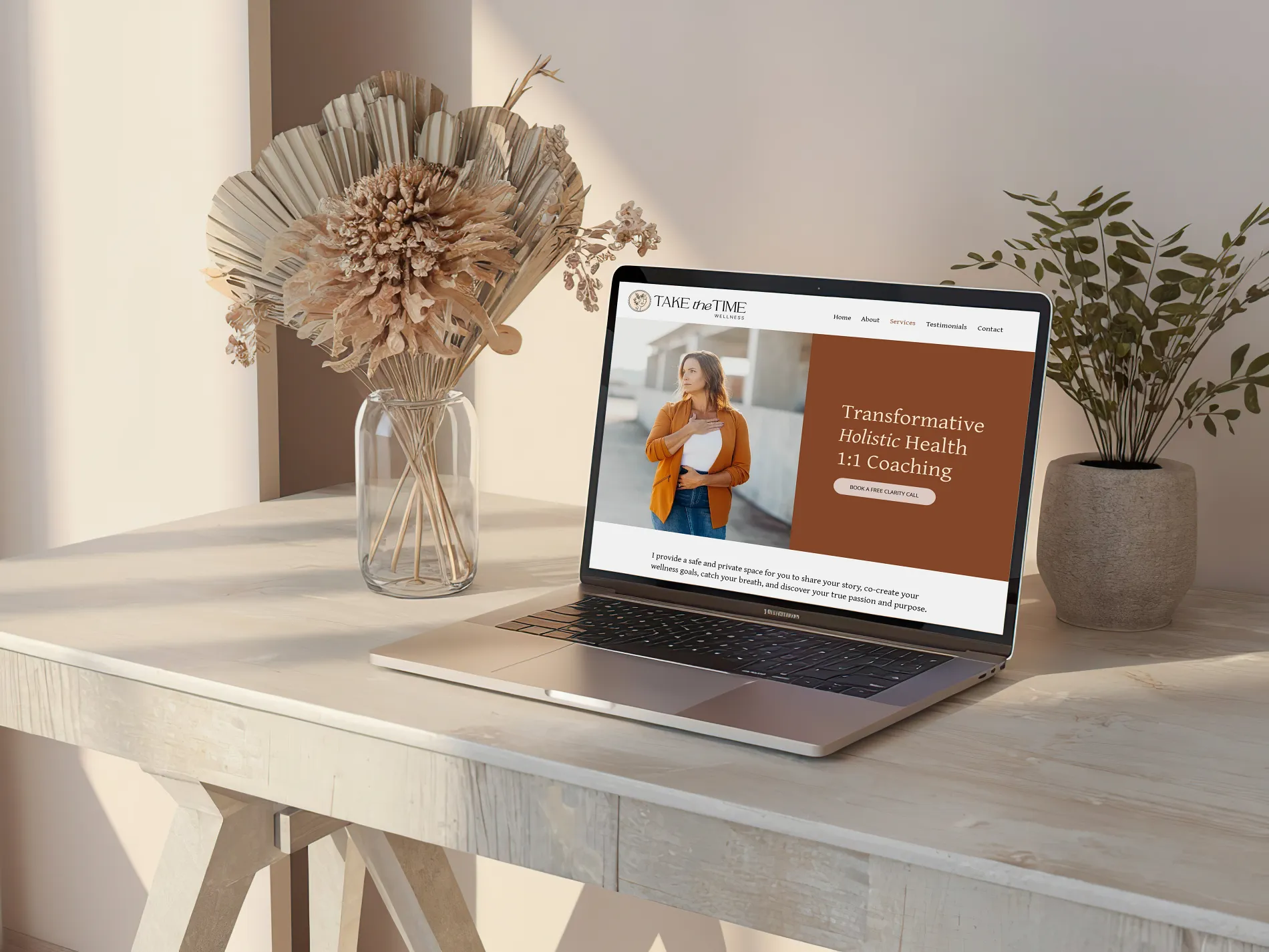 Take the Time Wellness website displayed on a laptop in a minimalist office setup, holistic coaching website design by Dream Wild Studio