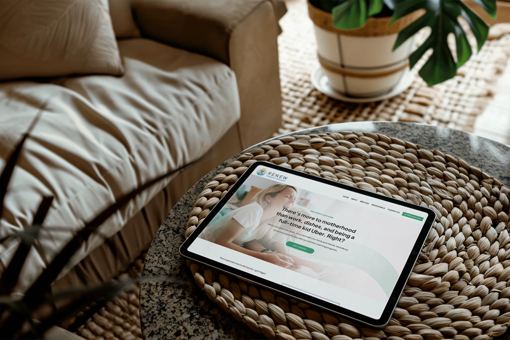 Tablet displaying the wellness website, placed on a table in a cozy, plant-filled setting, reflecting a natural and holistic brand aesthetic, designed by Dream Wild Studio.