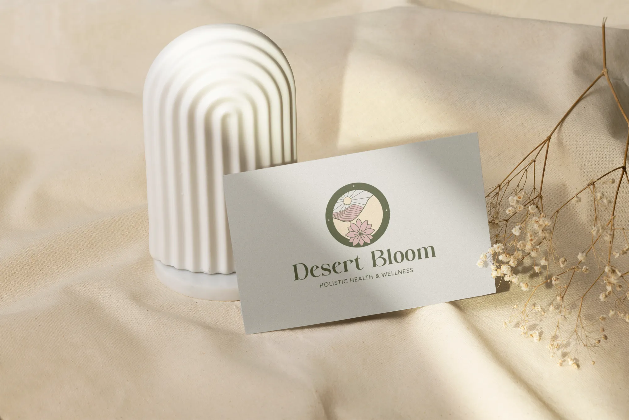 Desert Bloom Logo on Business Card Desert Bloom logo printed on a business card in a soft styled setting for a holistic wellness company, branding by Dream Wild Studio