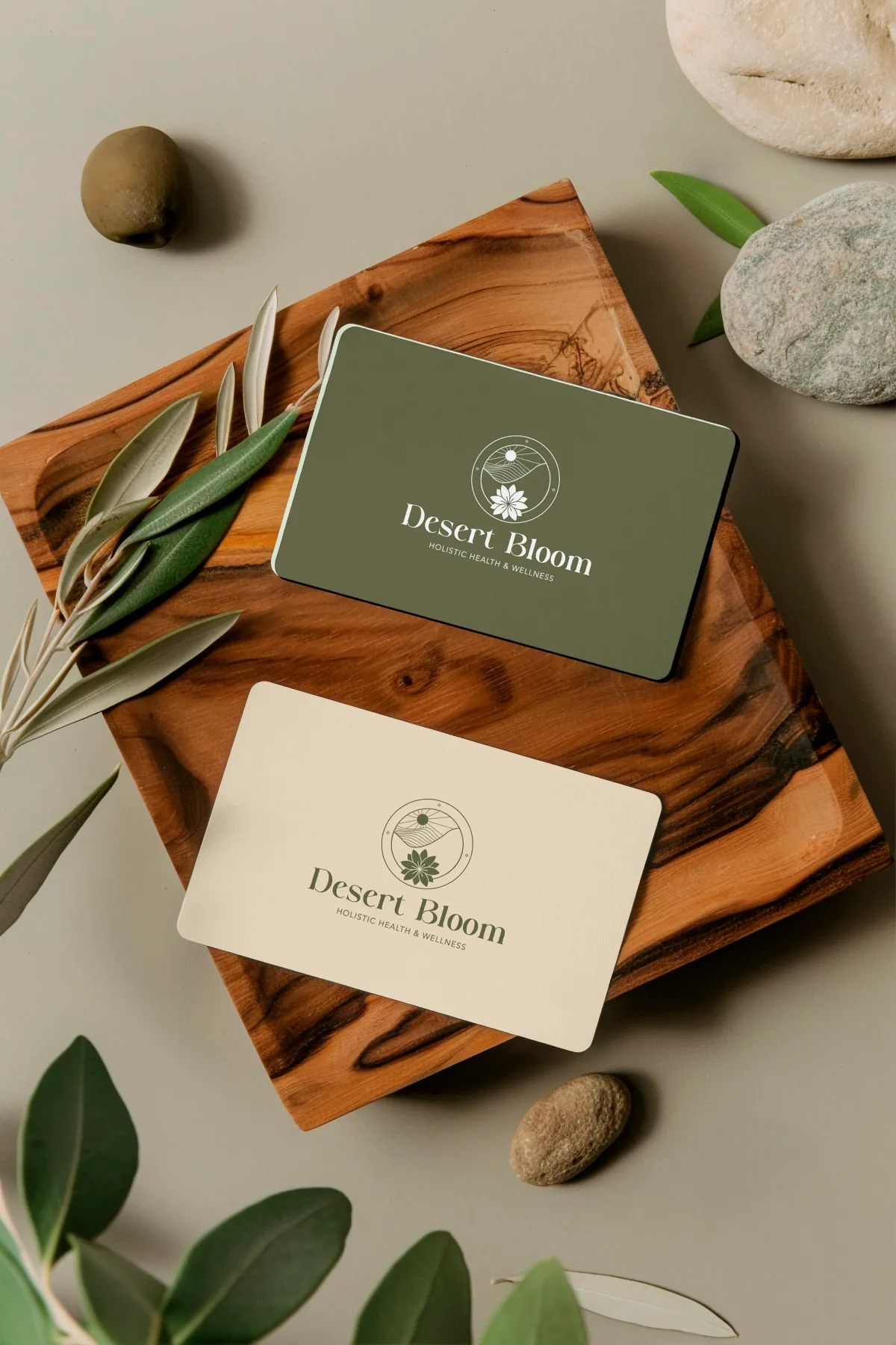 Desert Bloom Business Card Design Desert Bloom business cards in olive green on a wooden board with greenery for a holistic wellness company, branding by Dream Wild Studio