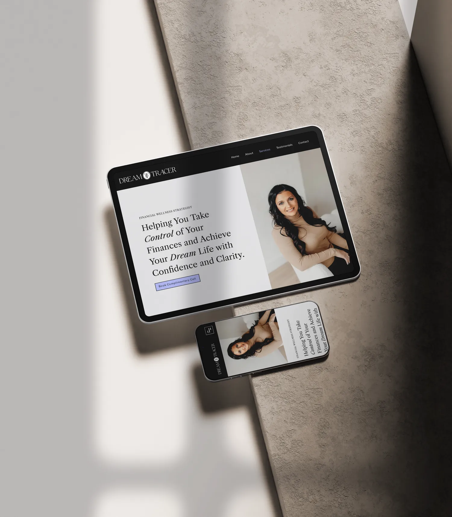 Tablet displaying the Dream Tracer website design for a financial strategist brand. Designed by Dream Wild Studio.