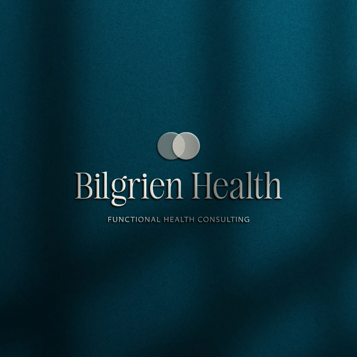 Logo design displayed on a textured background for holistic health consultant and wellness coach. Branding by Dream Wild Studio