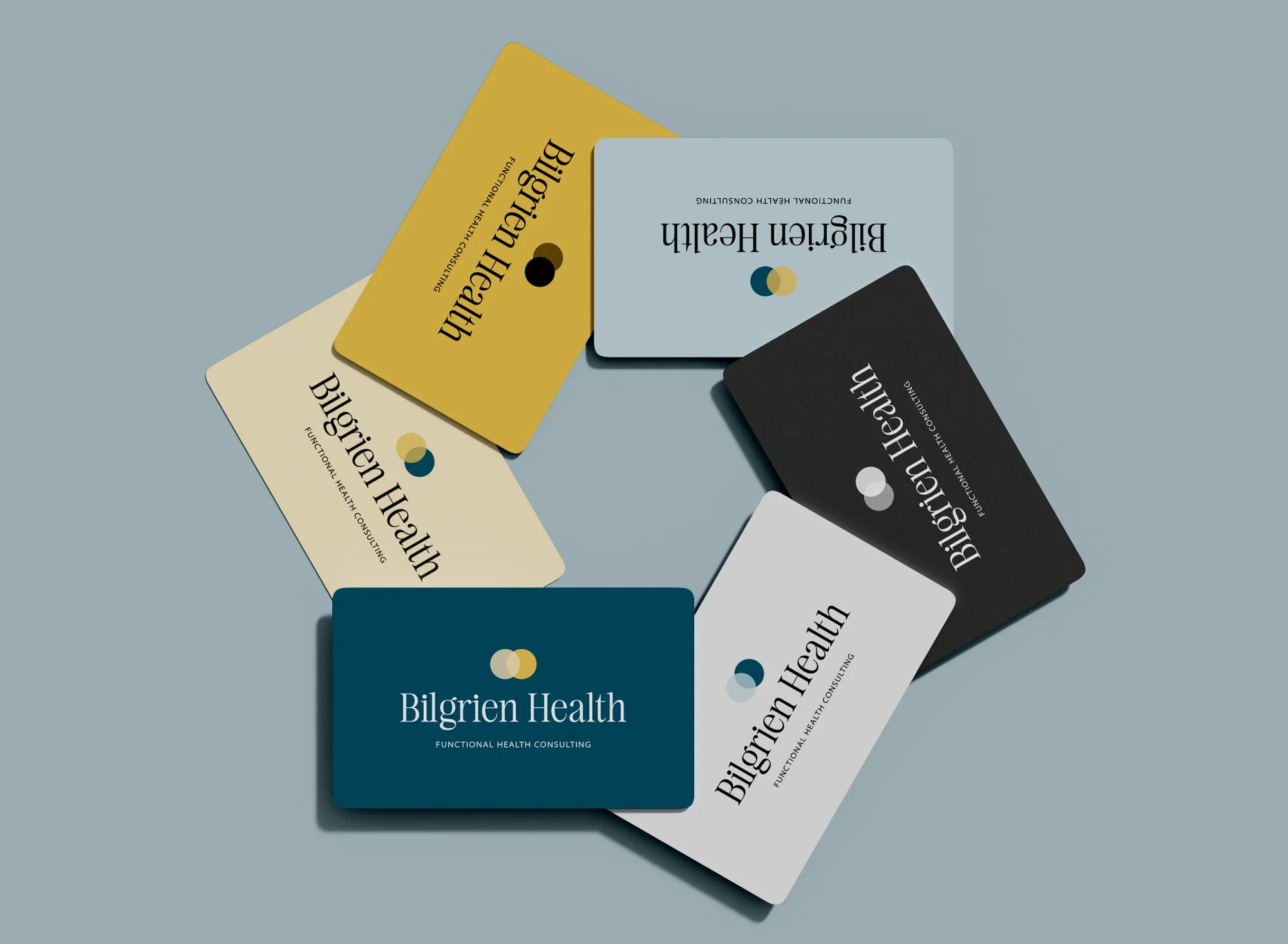 Bilgrien Health Brand Identity Cards Scattered teal and gold business cards showing the Bilgrien Health brand identity for a holistic health consultant, branding by Dream Wild Studio