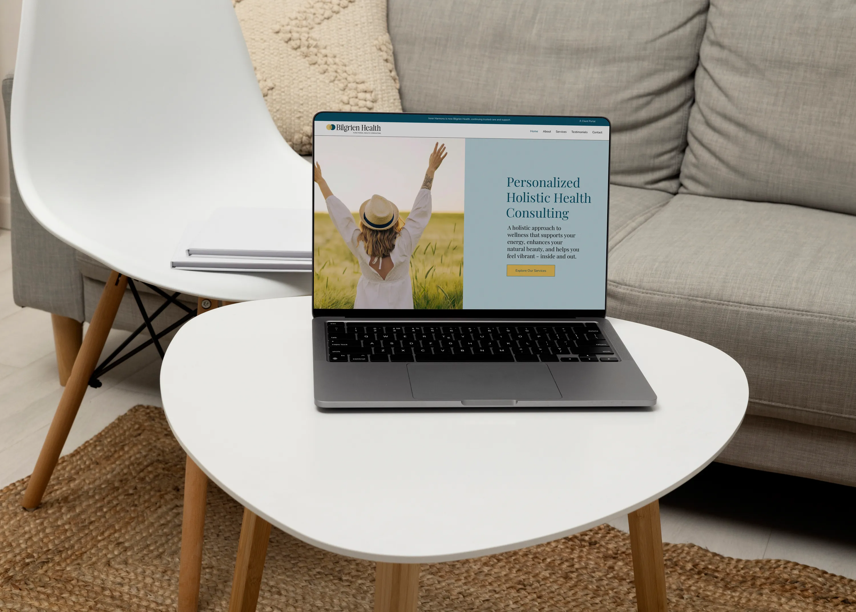Holistic Health Business Website Design Bilgrien Health website displayed on a laptop on a modern coffee table, holistic health consultant website design by Dream Wild Studio