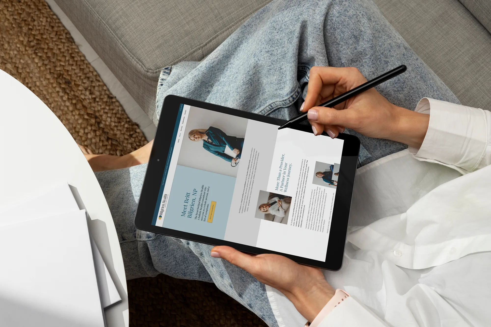 Bilgrien Health Responsive Website Design Hand using a stylus on a tablet displaying the responsive Bilgrien Health website for a holistic health consultant, website design by Dream Wild Studio