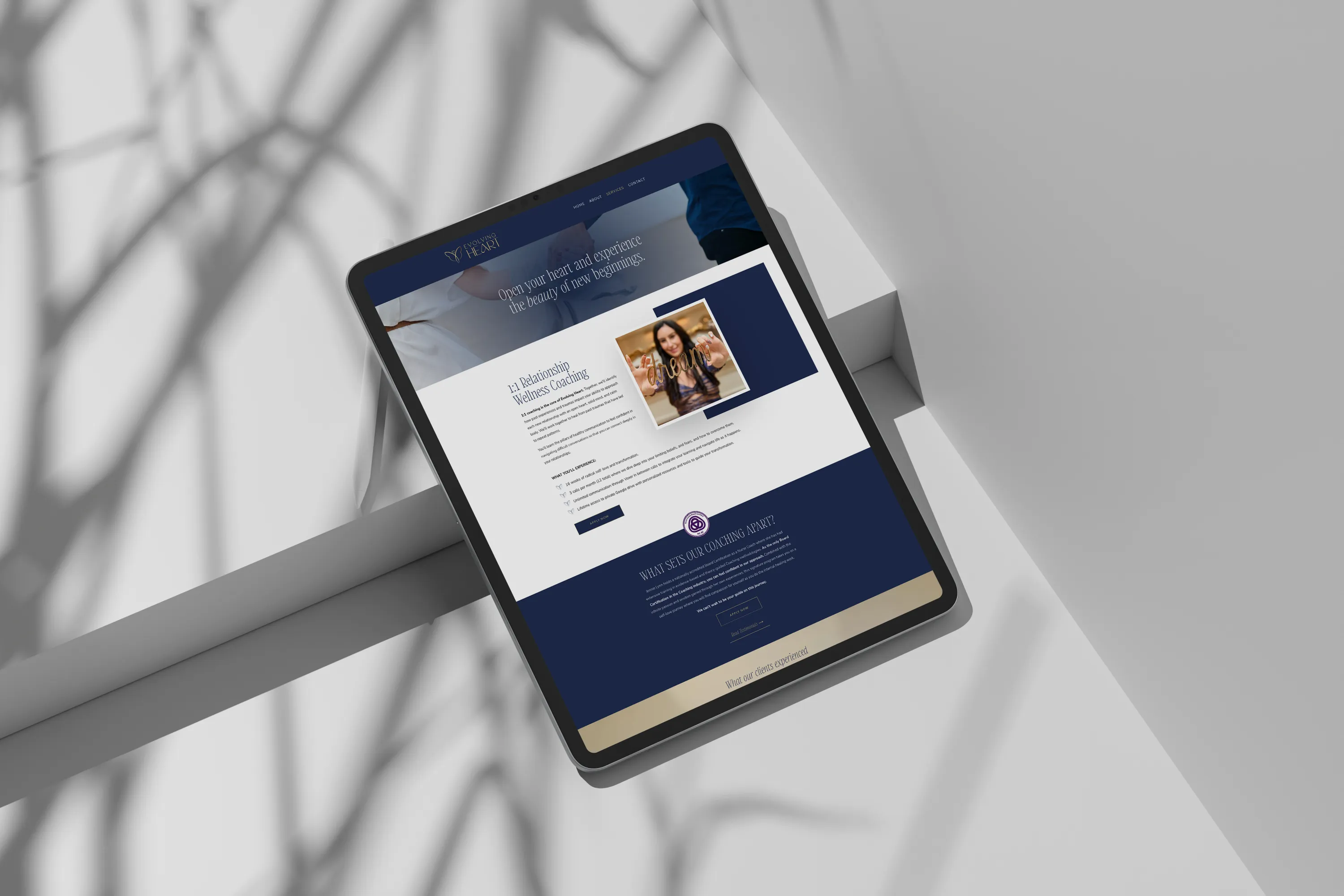 Wellness Relationship Coaching Website Design The laptop displays the website for a holistic wellness coaching company. Website design by Dream Wild Studio.