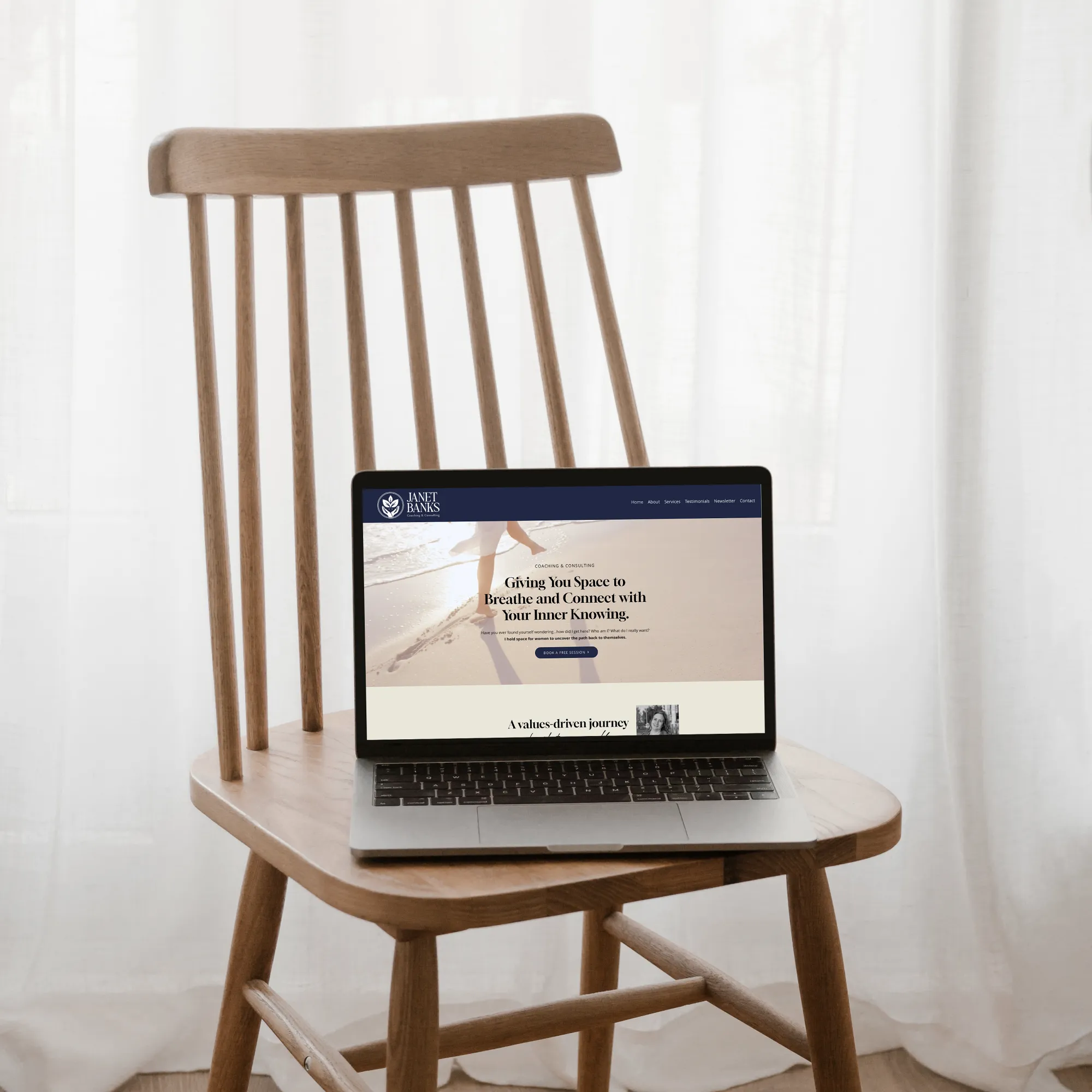 Laptop display the website for a nurse and life coach, by Dream Wild Studio.