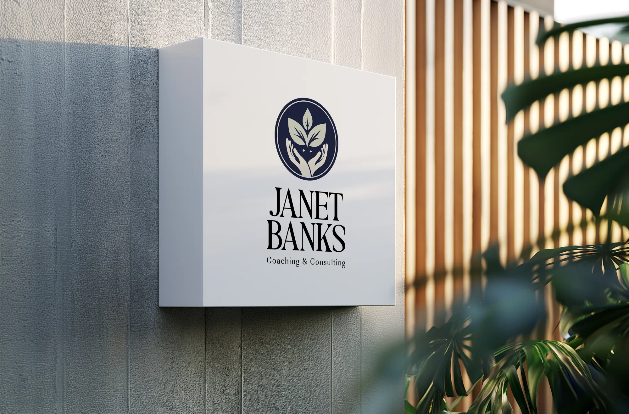 Wellness brand logo sign for Janet Banks mounted on modern building exterior, by Dream Wild Studio.