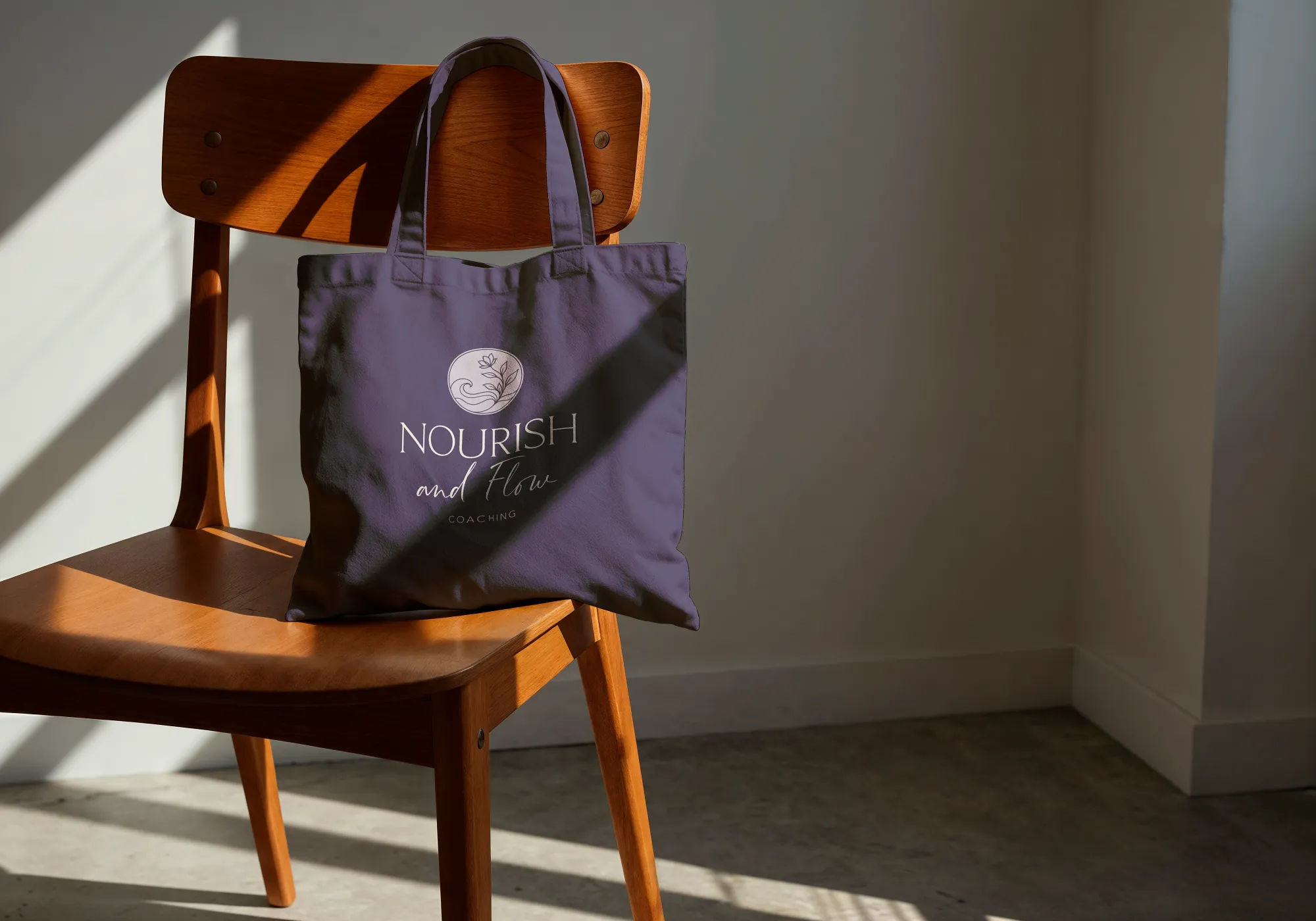 Nourish and Flow Coaching brand design shown on a tote bag, designed by Dream Wild Studio