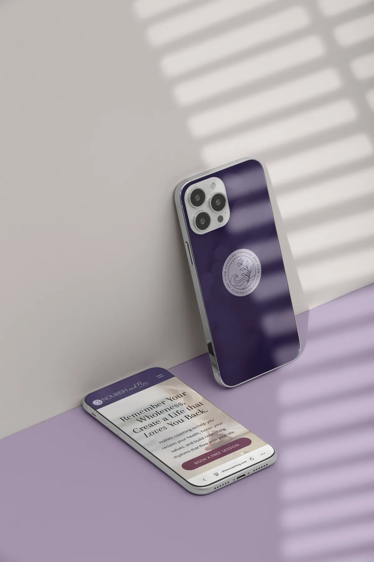 Nourish and Flow Coaching mobile website mockup shown beside a branded phone case, designed by Dream Wild Studio.