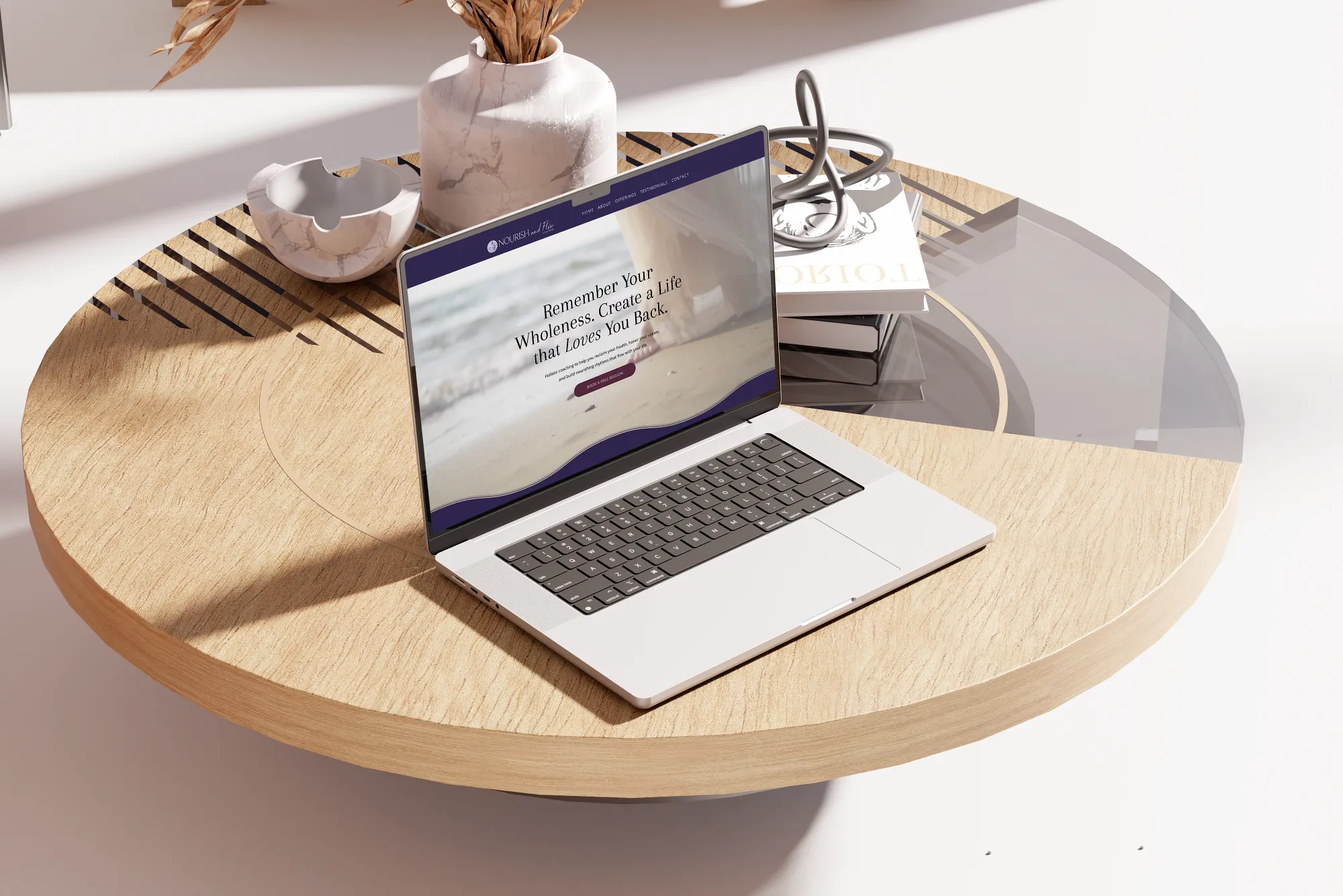 Nourish and Flow Coaching website mockup shown on a laptop for a holistic nurse coach brand, designed by Dream Wild Studio