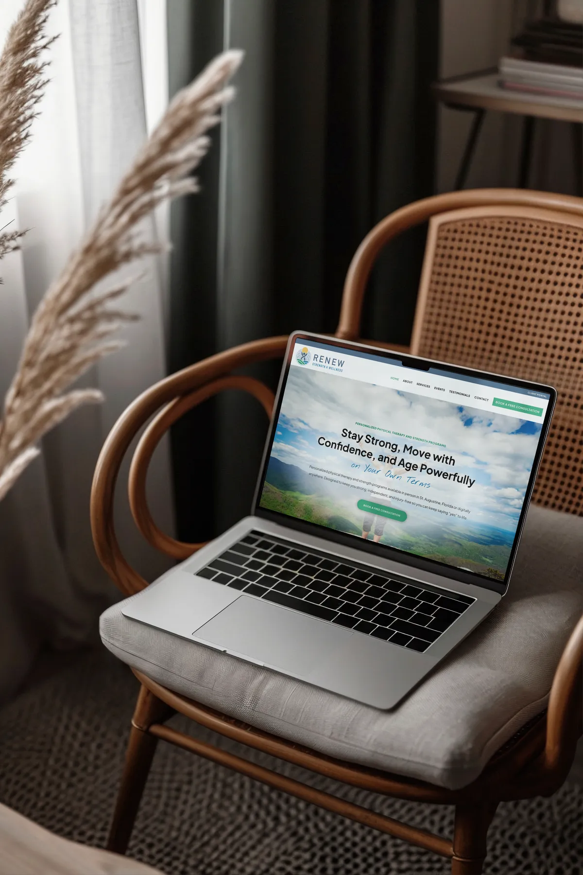 Custom wellness business website displayed on a tablet in a warm studio setting, designed by Dream Wild Studio.