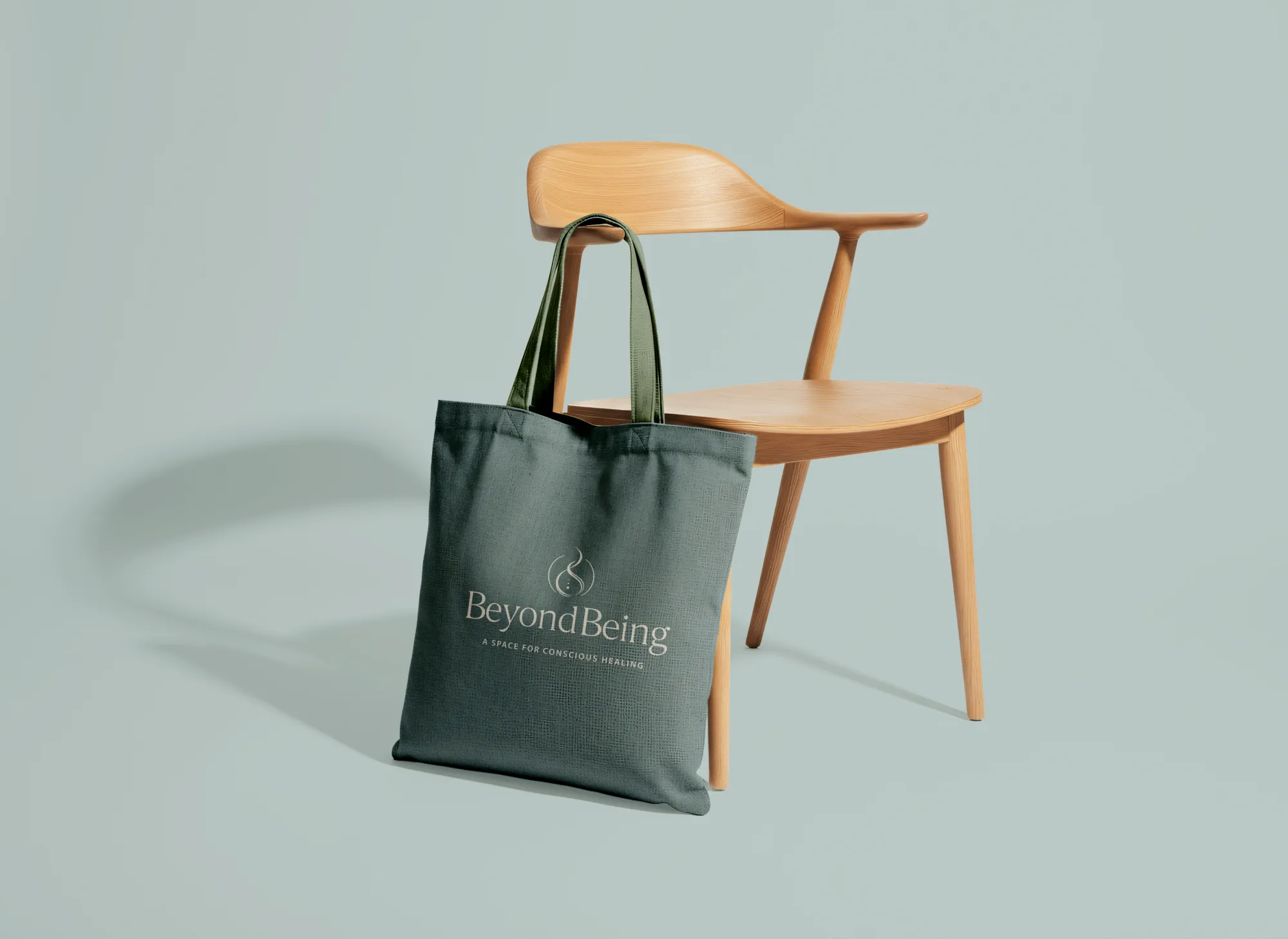 Integrative healing logo design displayed on a dark green tote bag by Dream Wild Studio