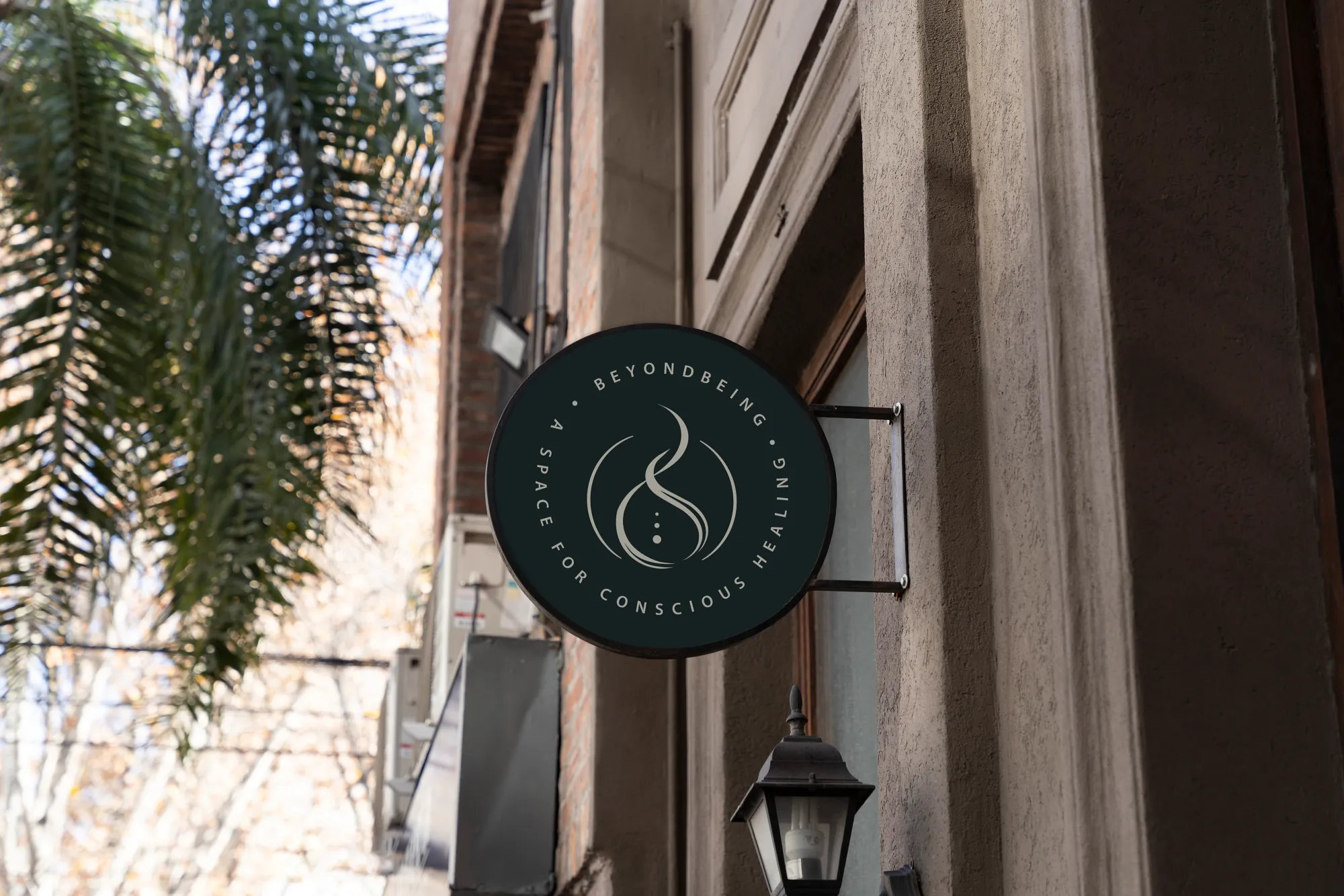 Integrative healing logo design displayed on a dark green tote bag by Dream Wild Studio